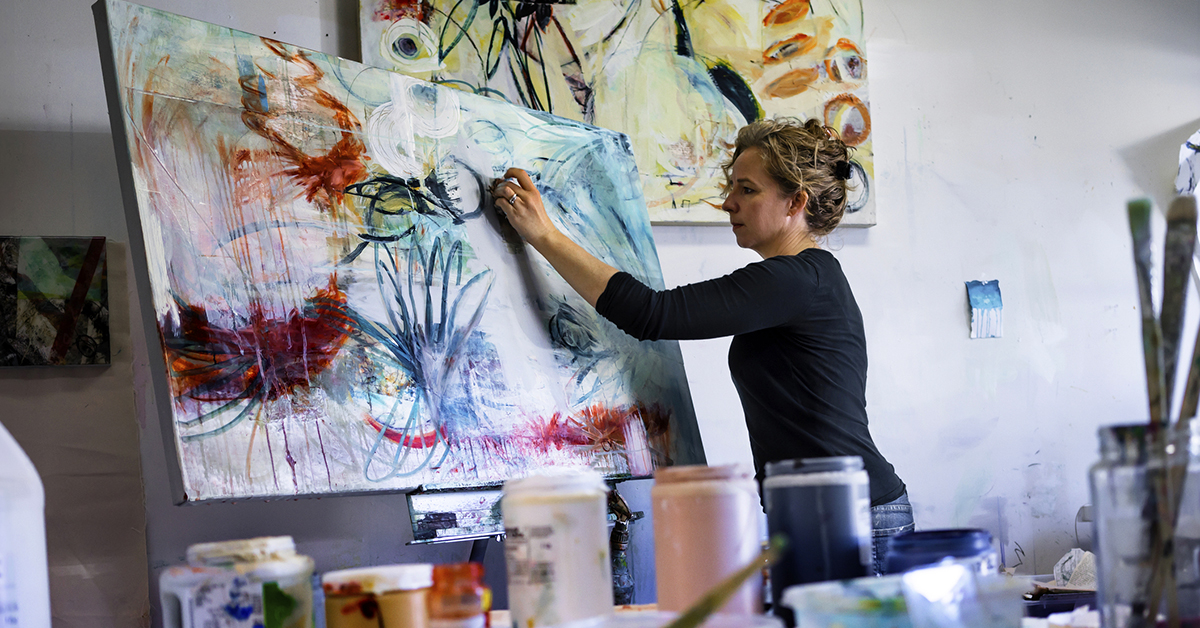 Side view of woman painting