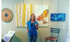 Kellie-Day-with-her-work-at-the-Skol-Gallery---Ouray-colorado