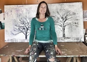 Kellie Day with Winter Tree paintings ©Kellie Day