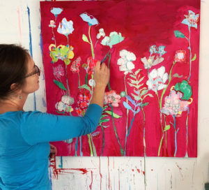 Kellie Day painting a floral